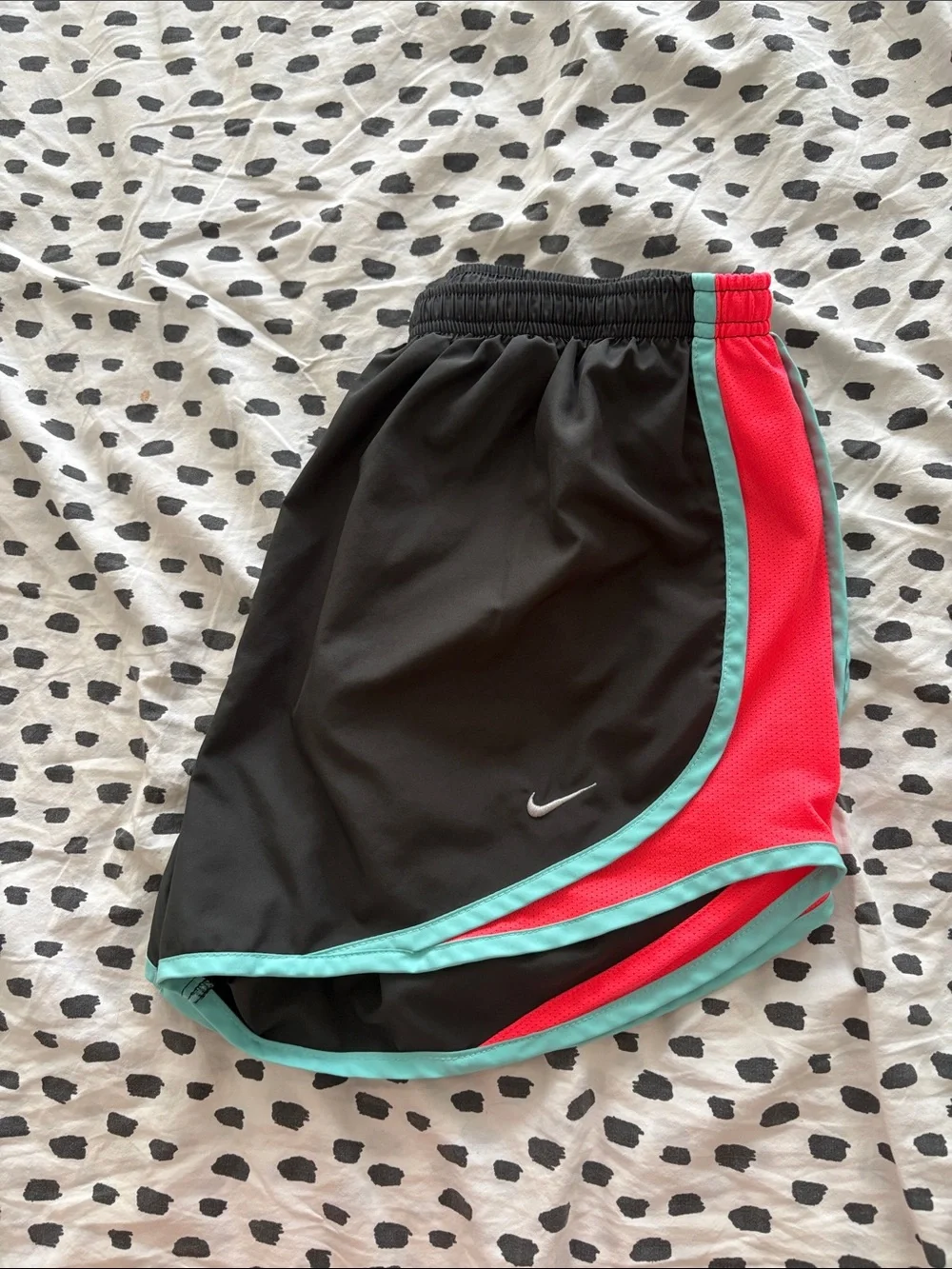 Nike Black Athletic Shorts with Teal Trim and Coral Side Panels